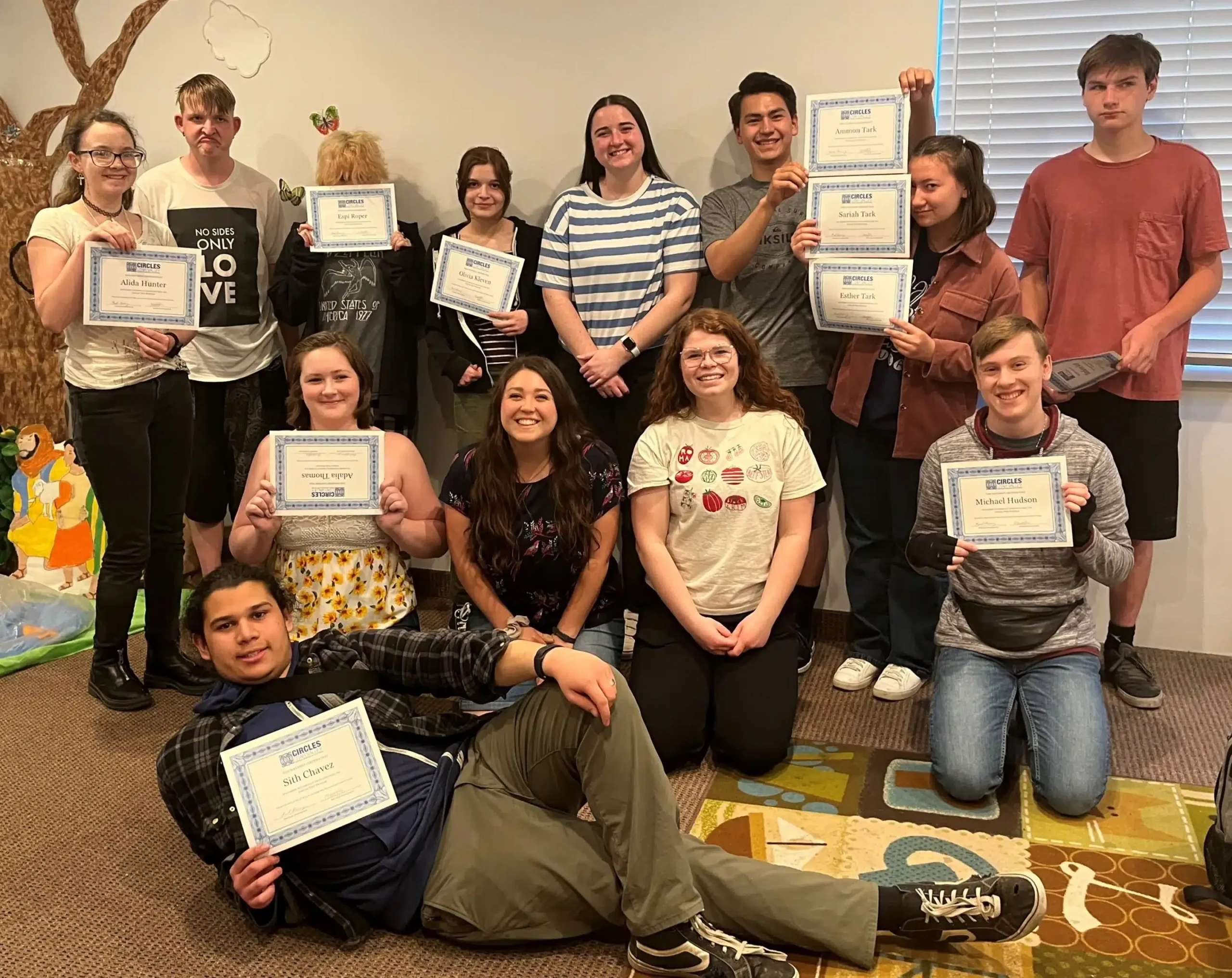 Circle teens class and showcasing last class teens in picture holding certificates